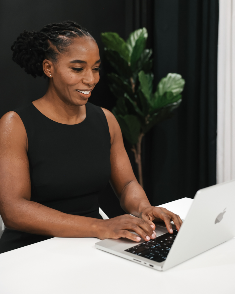 Dr. Hope L. Hayes smiling during an online pelvic floor therapy consultation, providing a supportive and reassuring presence